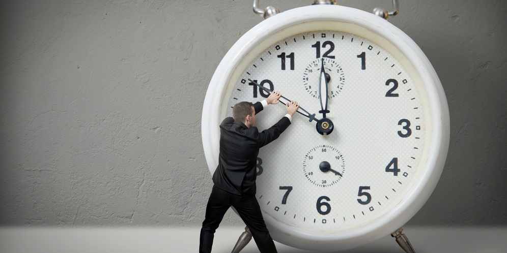 illustration - man in front of a giant clock, illustrating the obstacle of time